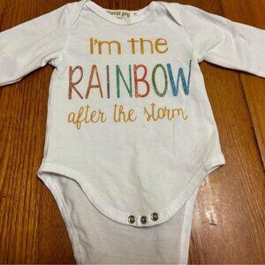 White, long sleeve 6-12 mth onesie with I'm the Rainbow After the Storm on it